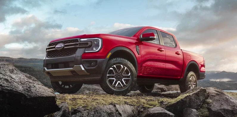 A red 2025 Ford Ranger off-roading.