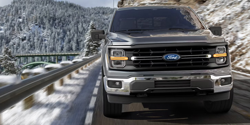 2026 Grey Ford F-150 cruising road side.