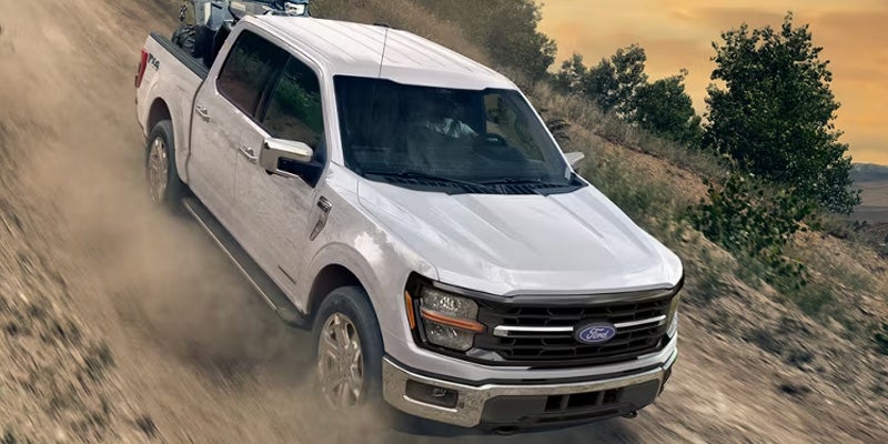 White 2026 Ford F-150 climbing down hill